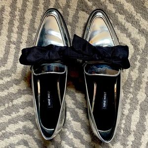 Silver pointy toe Nine West flats with bow
